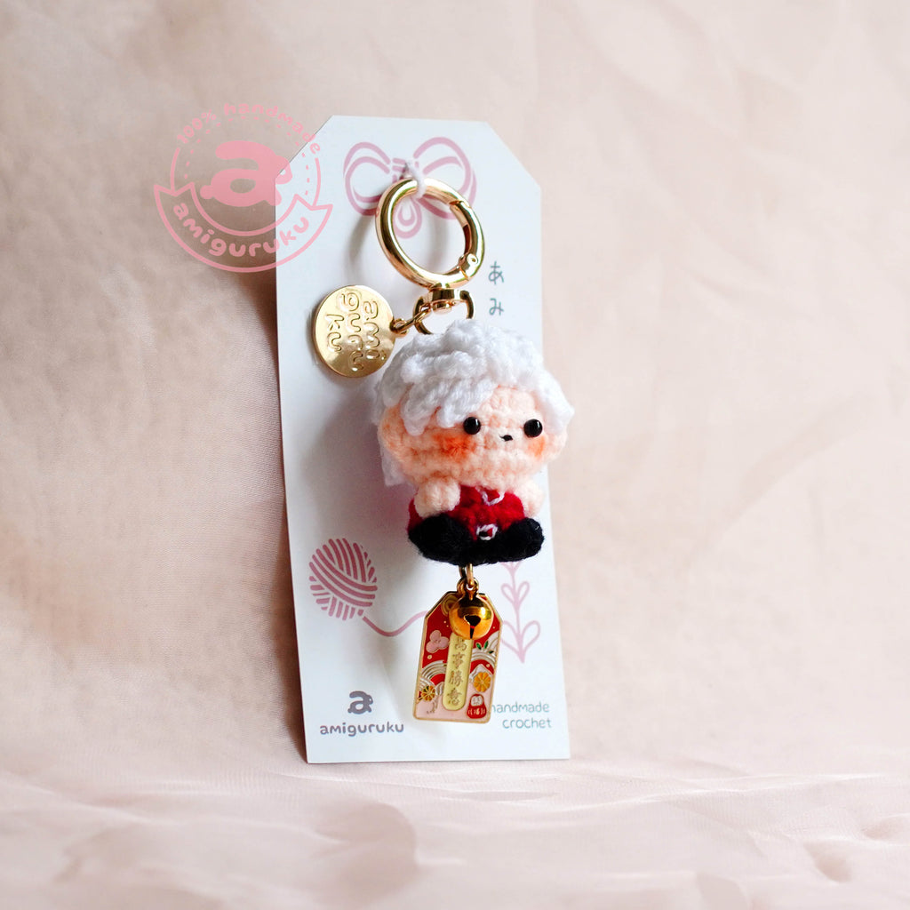 Keychain with a character on a pink background