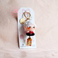 Keychain with a character on a pink background