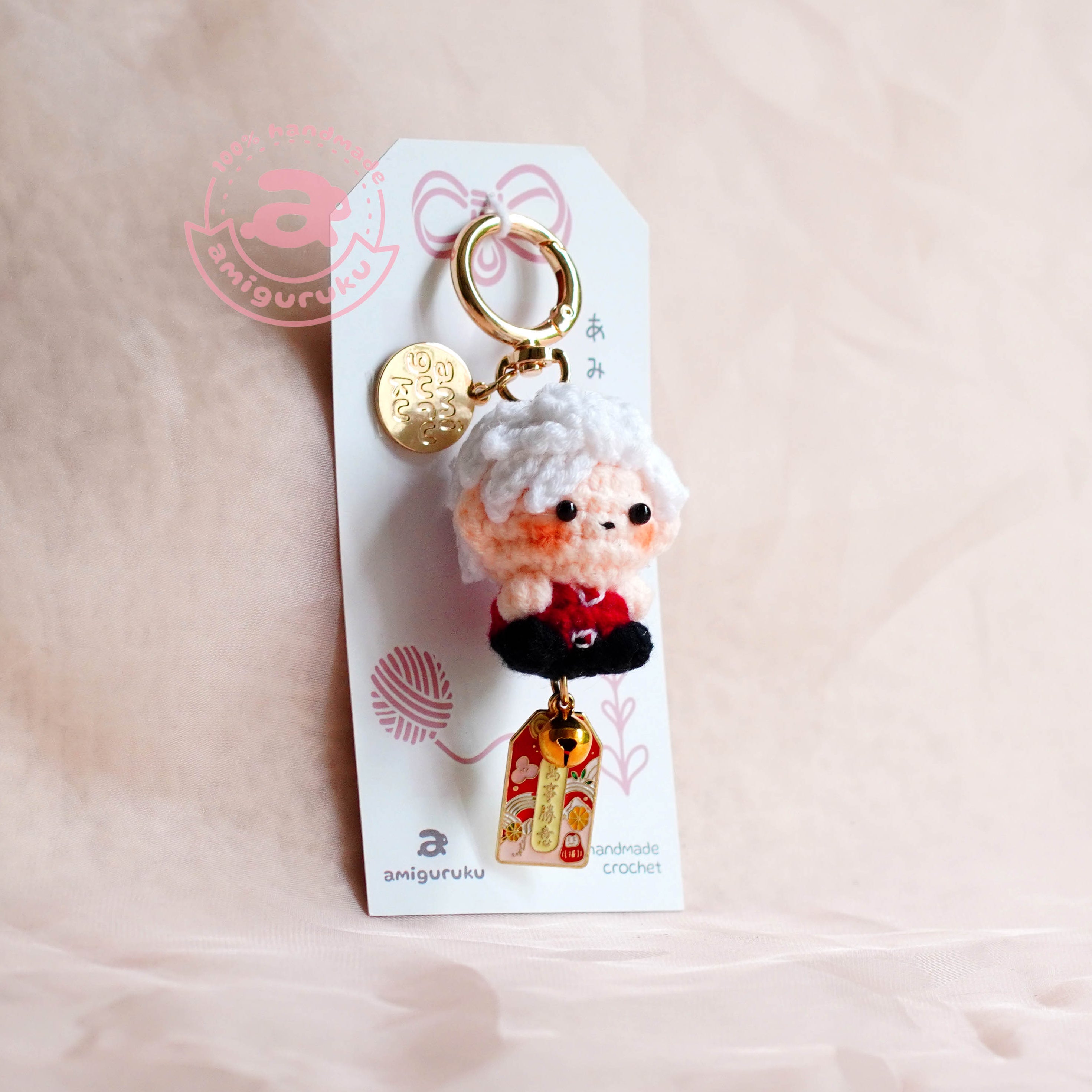 Keychain with a character on a pink background